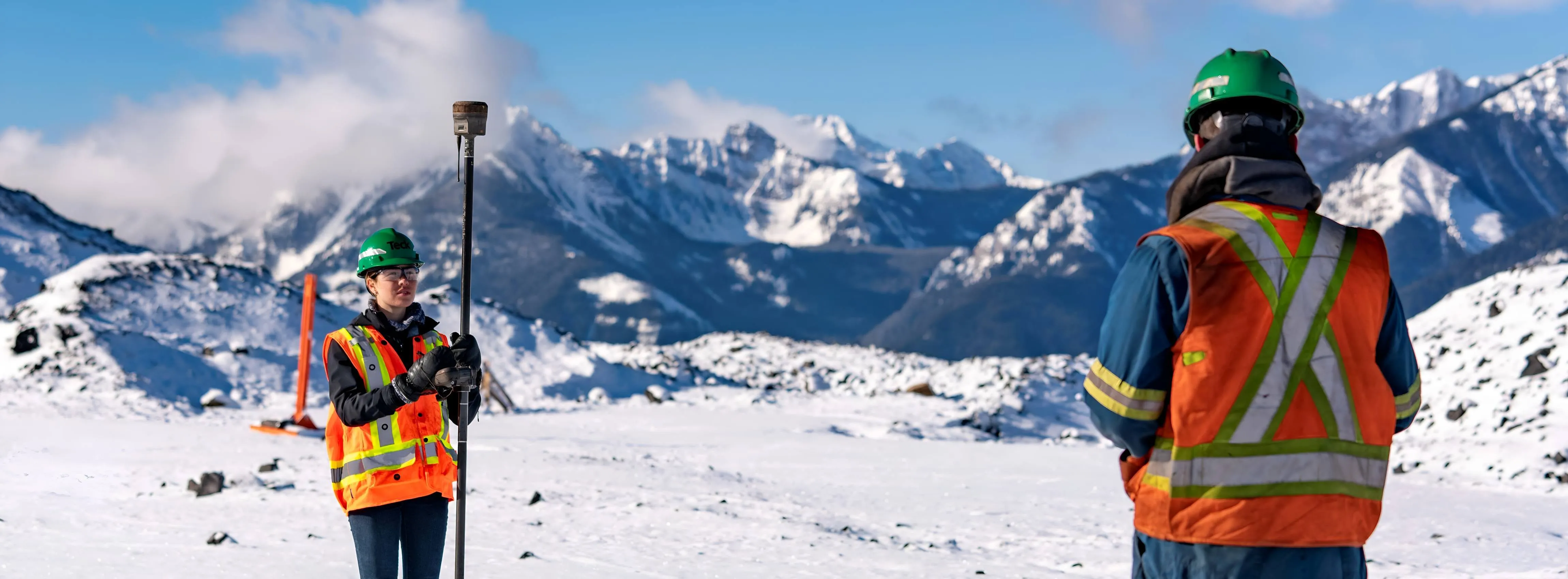 Two individuals on a snowy mountain
