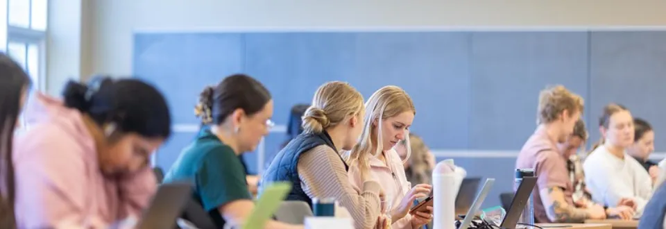 Two students in a classroom.